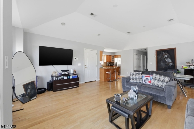433 Linden Avenue Elizabeth, NJ 07202 - Photo 7 of 33 a living room with furniture and a flat screen tv