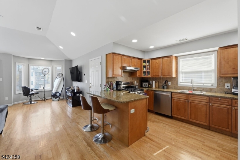 433 Linden Avenue Elizabeth, NJ 07202 - Photo 8 of 33 a kitchen with sink refrigerator and large window