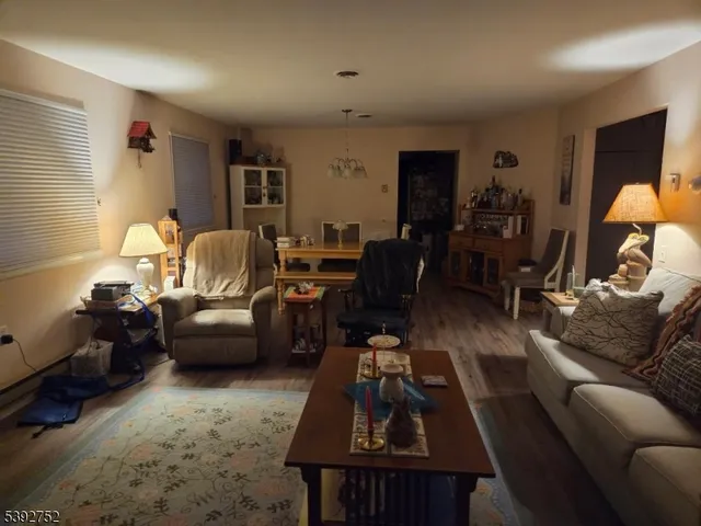 a living room with furniture fireplace and a flat screen tv