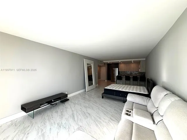 a bedroom with furniture and a bed