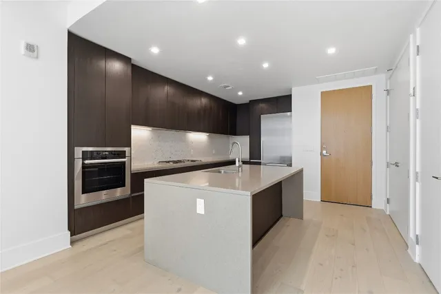 a bathroom with a shower and a sink
