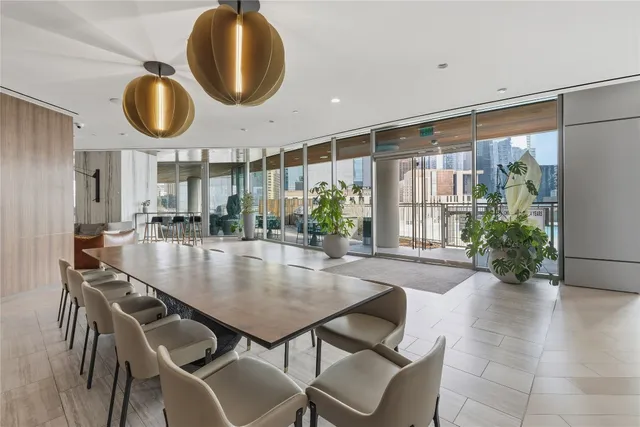 a living room with furniture a rug and a large window