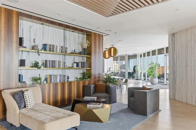 a view of kitchen with refrigerator and microwave