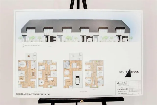 a view of hallway with stairs and wooden floor