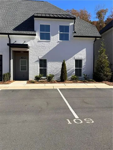 a view of house with yard