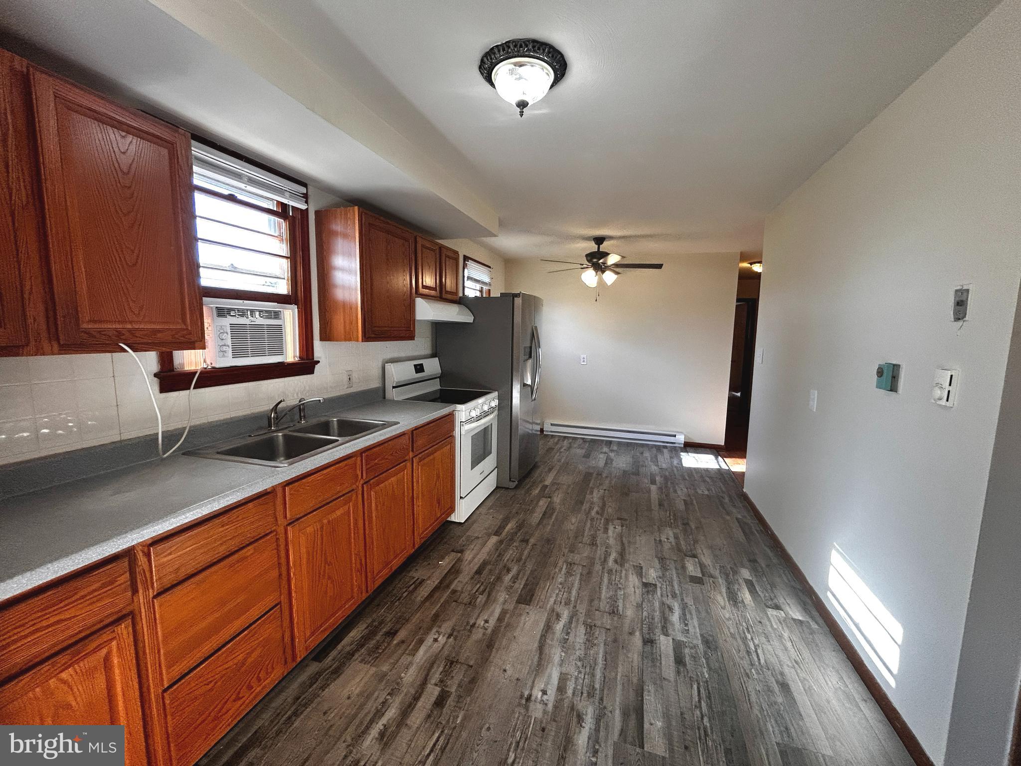 760 Jordan Springs Road Stephenson, VA 22656 - Photo 11 of 27 a large kitchen with a sink and wooden floor