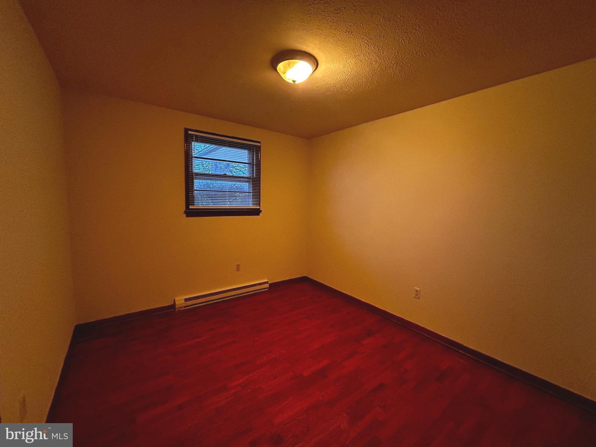 760 Jordan Springs Road Stephenson, VA 22656 - Photo 20 of 27 an empty room with a empty space and a window