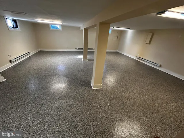 an empty room with a empty space and windows