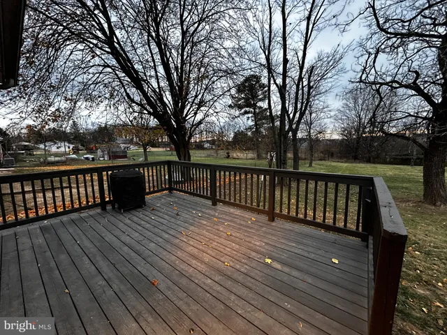 a view of wooden deck with a trees