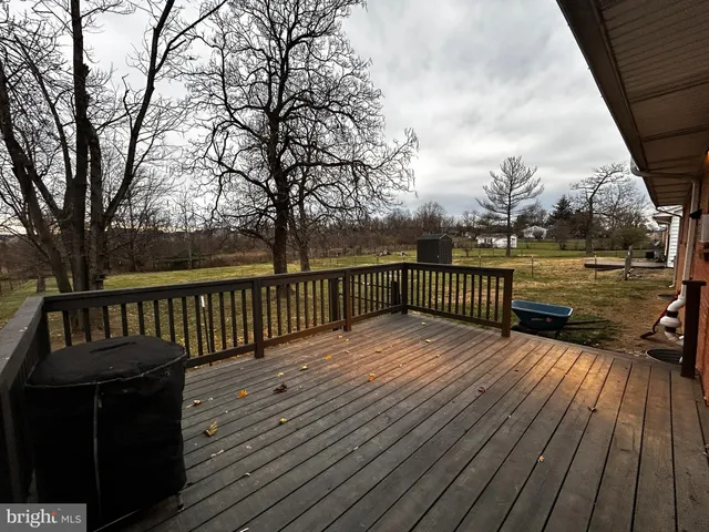 a view of deck with wooden floor and seating