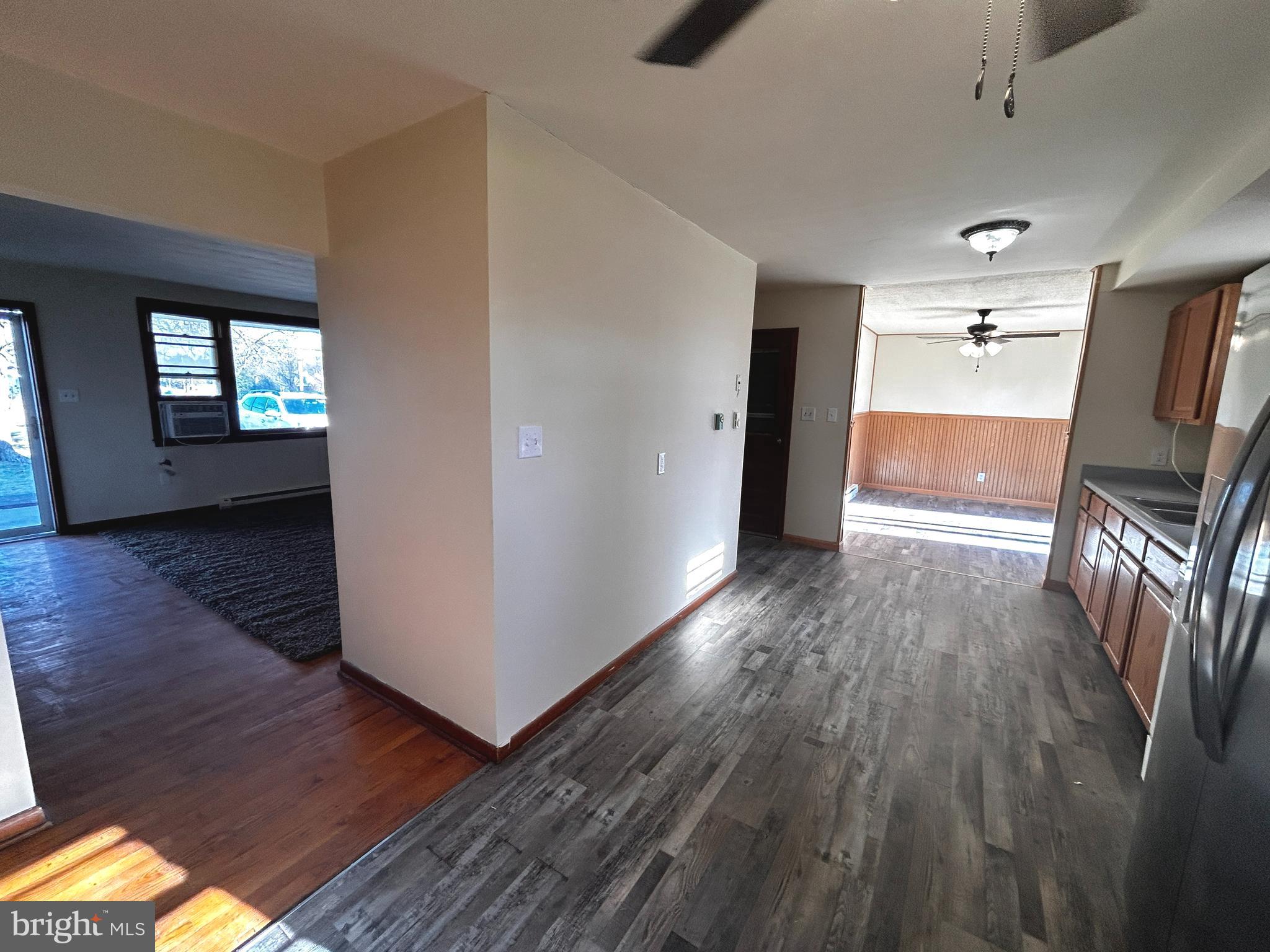 760 Jordan Springs Road Stephenson, VA 22656 - Photo 9 of 27 wooden floor in an empty room with a window