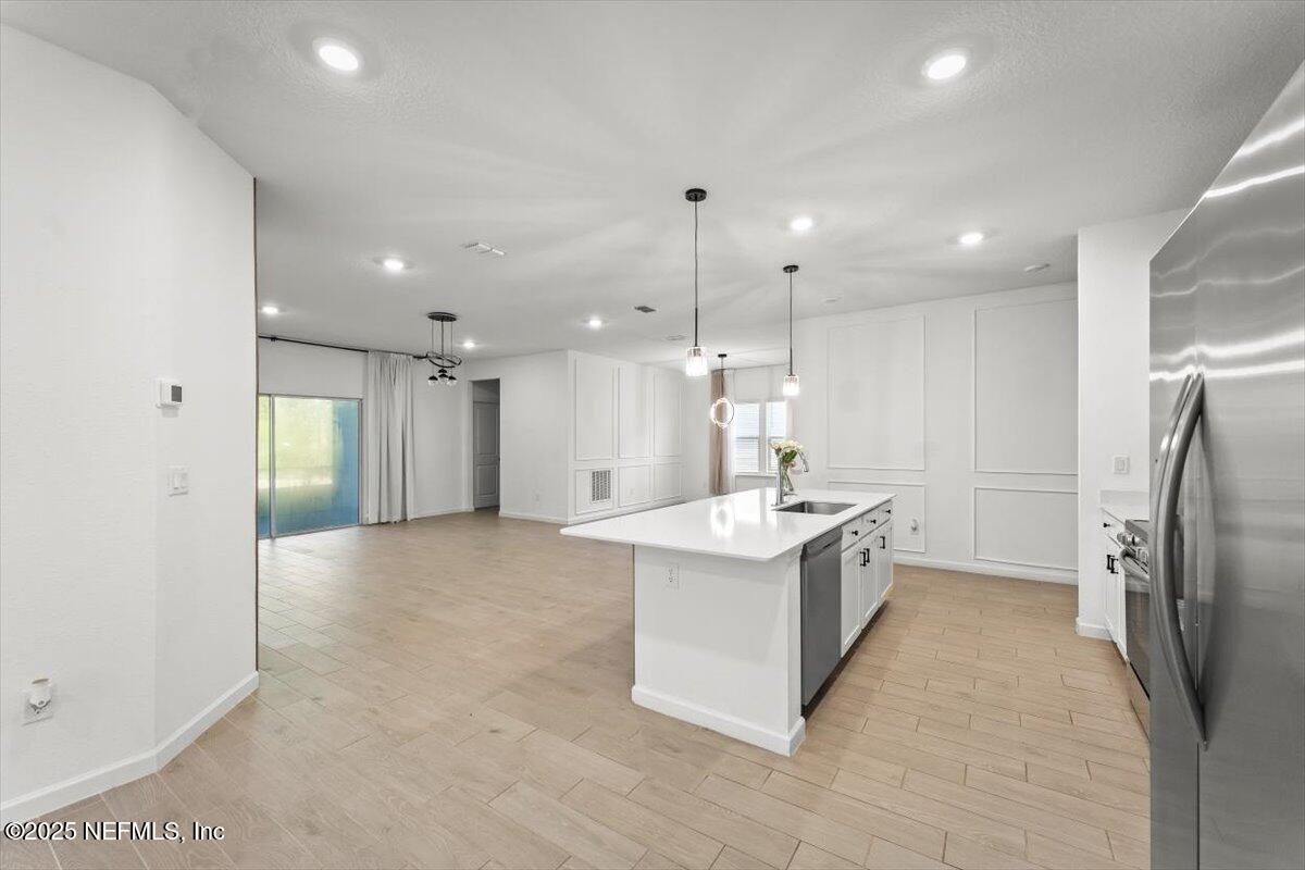 1598 Lachlan Circle Jacksonville, FL 32218 - Photo 15 of 38 a large kitchen with a sink and refrigerator