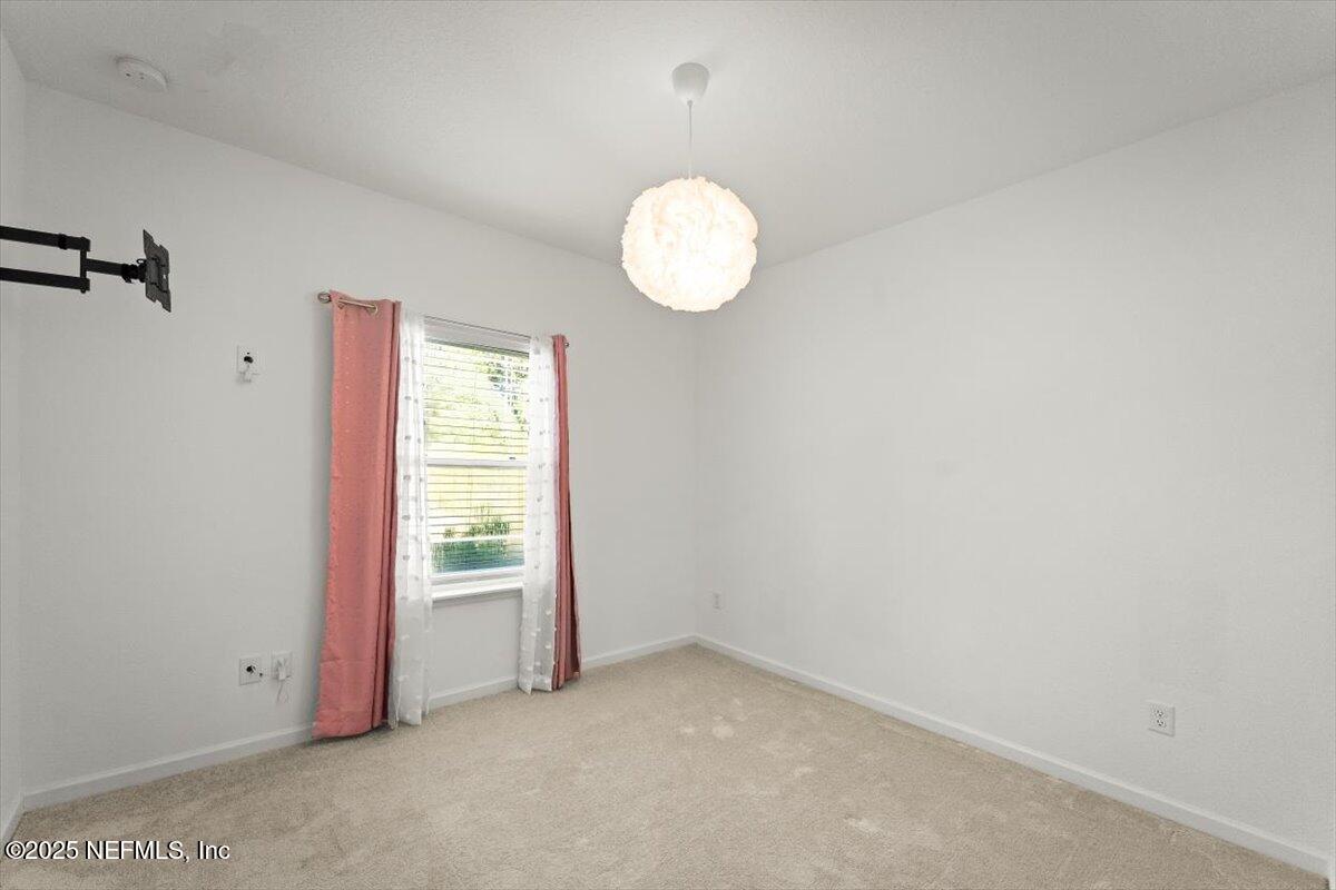 1598 Lachlan Circle Jacksonville, FL 32218 - Photo 19 of 38 a view of an empty room with a window