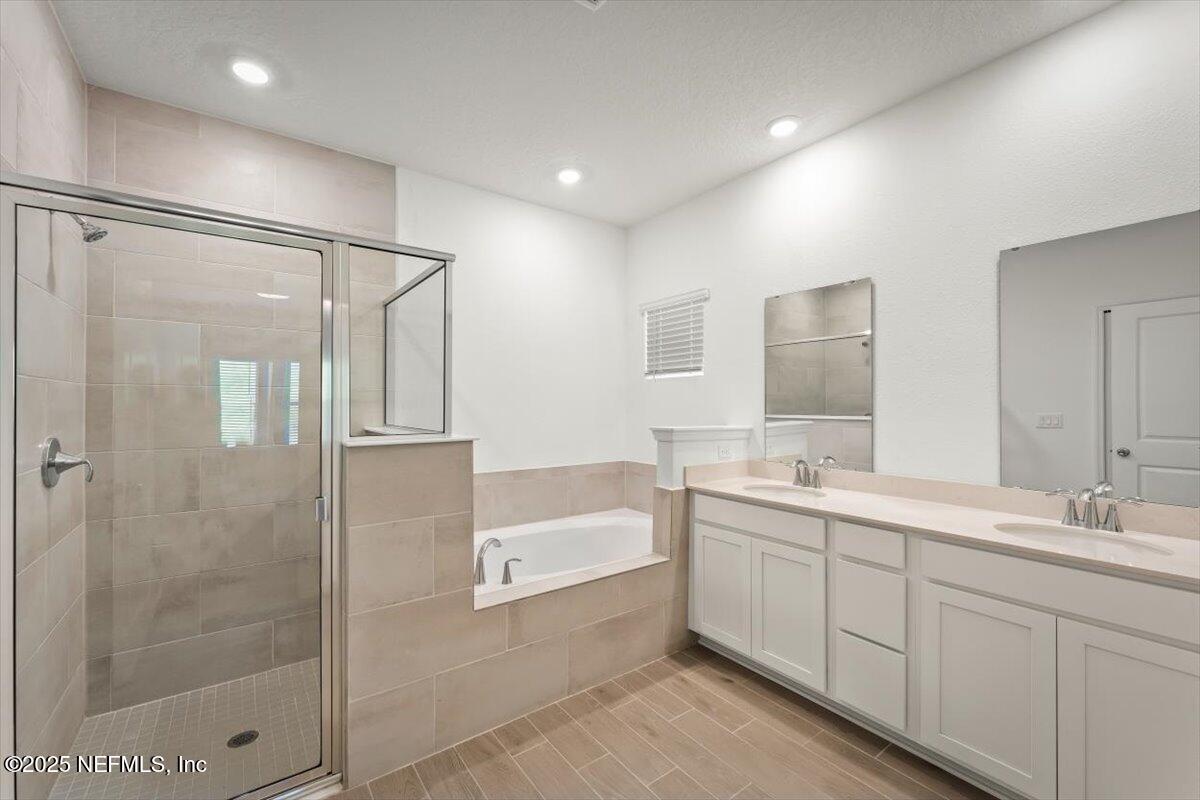 1598 Lachlan Circle Jacksonville, FL 32218 - Photo 30 of 38 a bathroom with a double vanity sink mirror and shower