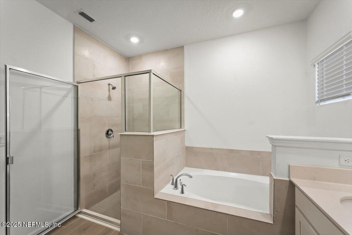 1598 Lachlan Circle Jacksonville, FL 32218 - Photo 31 of 38 a bathroom with a bathtub and a shower