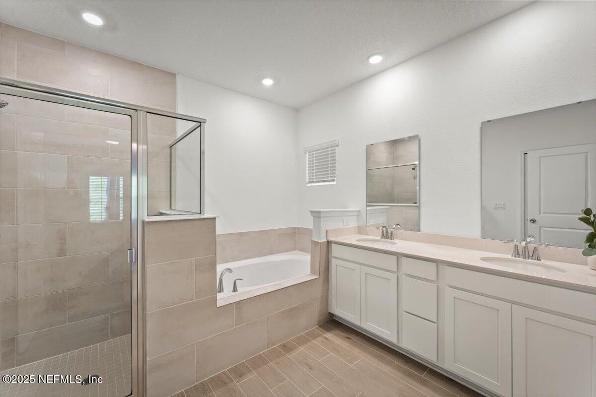 1598 Lachlan Circle Jacksonville, FL 32218 - Photo 32 of 38 a bathroom with a double vanity sink mirror and shower