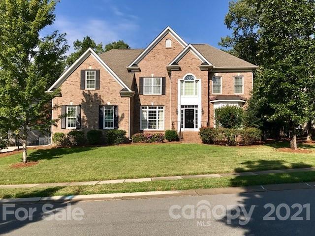 1912 Riverbank Road Waxhaw, NC 28173 - Photo 1 of 19 a front view of a house with a yard