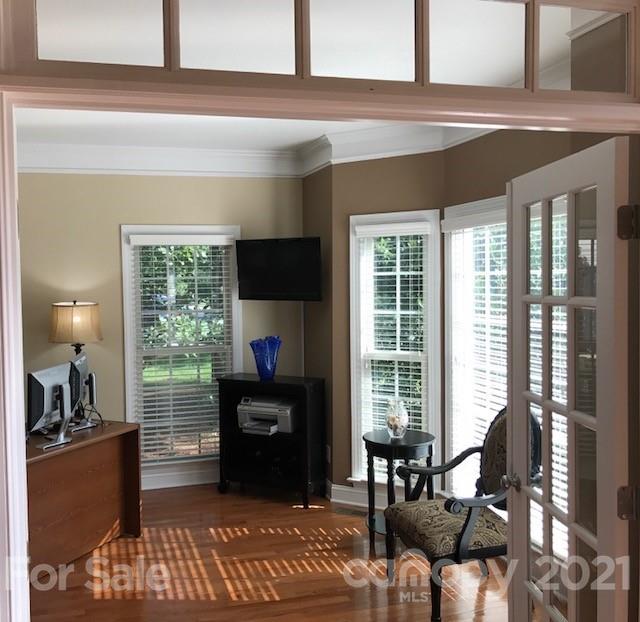 1912 Riverbank Road Waxhaw, NC 28173 - Photo 2 of 19 a living room with furniture and a flat screen tv