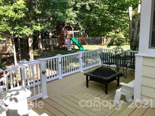 1912 Riverbank Road Waxhaw, NC 28173 - Photo 18 of 19 a view of a chairs on wooden deck