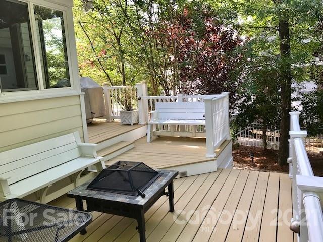 1912 Riverbank Road Waxhaw, NC 28173 - Photo 19 of 19 a view of a patio with chair and wooden floor