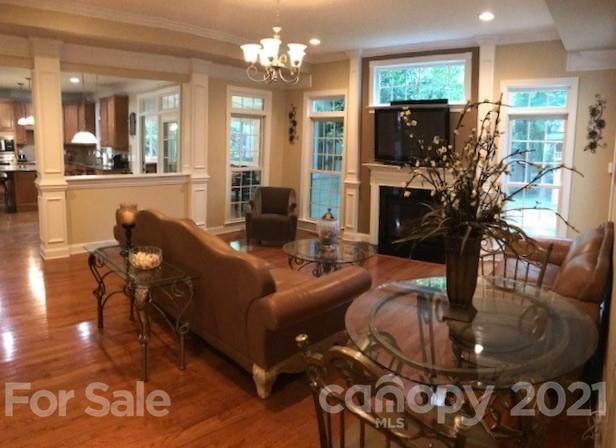 1912 Riverbank Road Waxhaw, NC 28173 - Photo 5 of 19 a living room with furniture and a chandelier