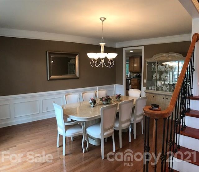 1912 Riverbank Road Waxhaw, NC 28173 - Photo 9 of 19 a view of a dining room with furniture window and wooden floor
