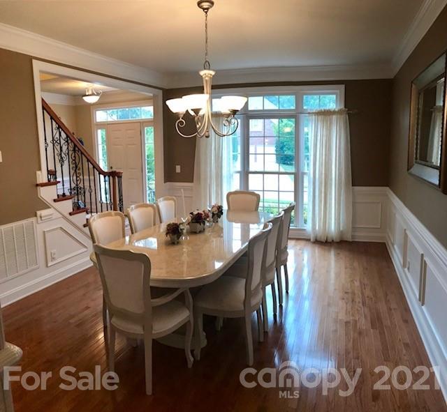 1912 Riverbank Road Waxhaw, NC 28173 - Photo 10 of 19 a view of a dining room with furniture window and wooden floor