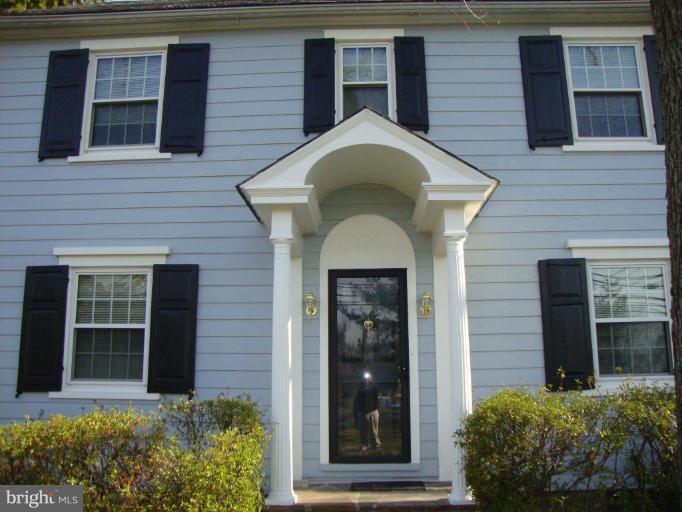 406 East Joppa Road Towson, MD 21286 - Photo 22 of 28 a front view of a house with a garden