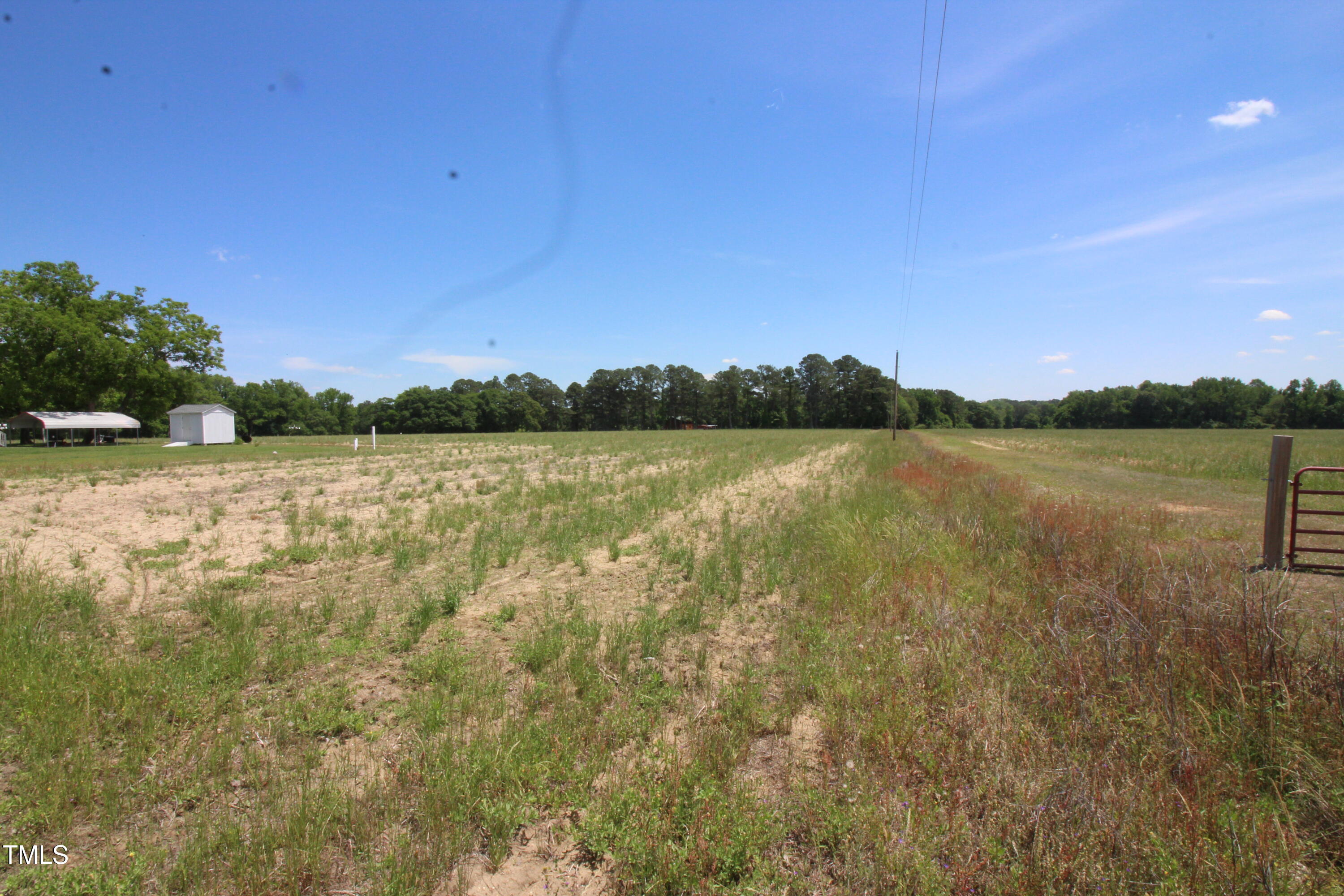 0 John Lee Road Dunn, NC 28334 - Photo 2 of 12 a view of lake with lots of green space