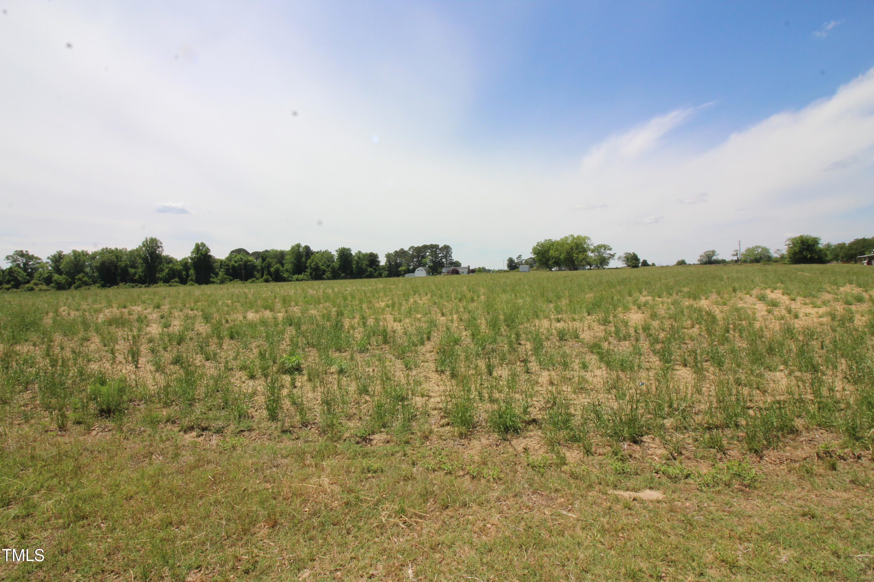 0 John Lee Road Dunn, NC 28334 - Photo 4 of 12 a view of a lake with houses in the background