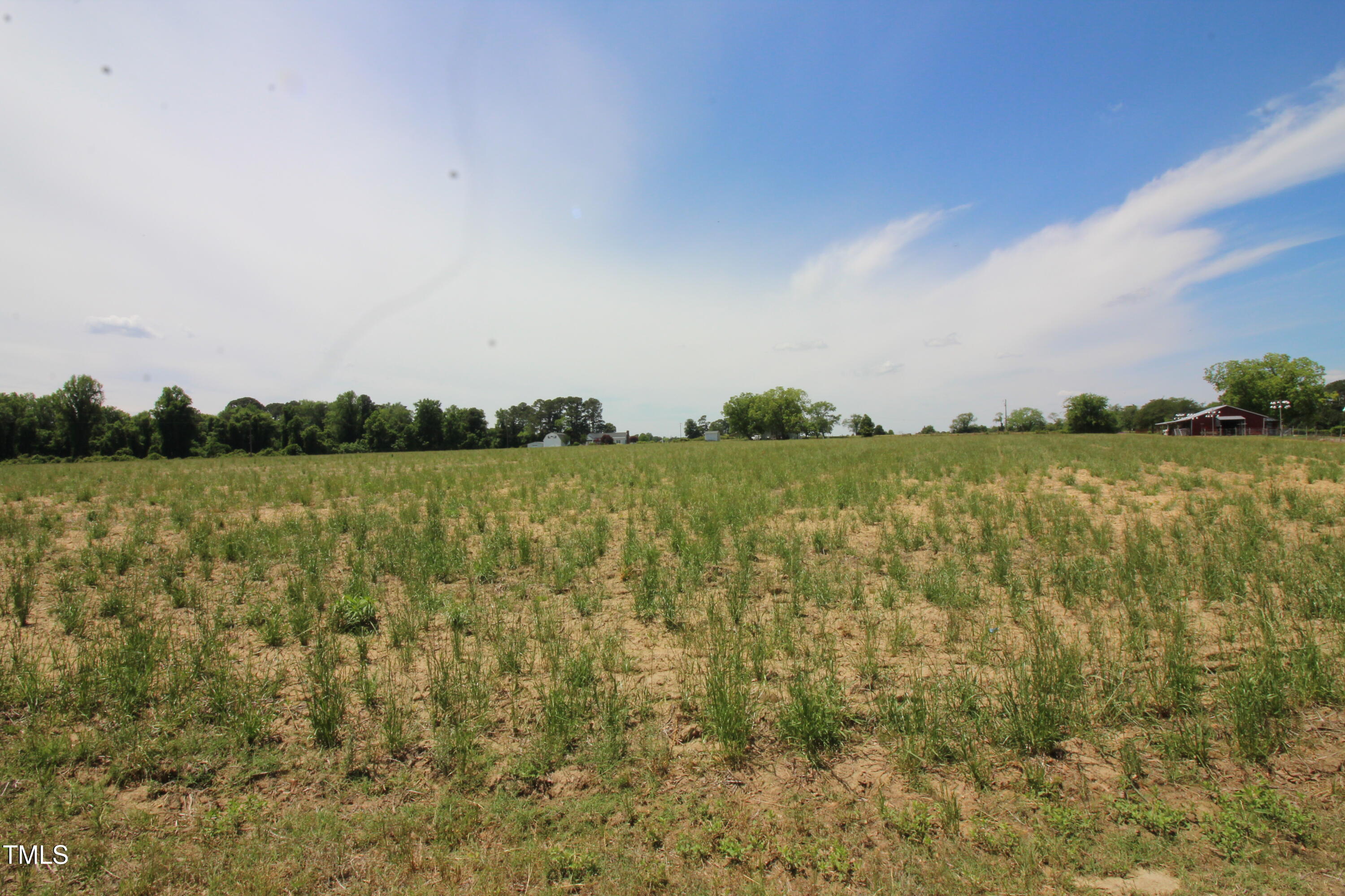 0 John Lee Road Dunn, NC 28334 - Photo 5 of 12 a view of a lake with houses in the back