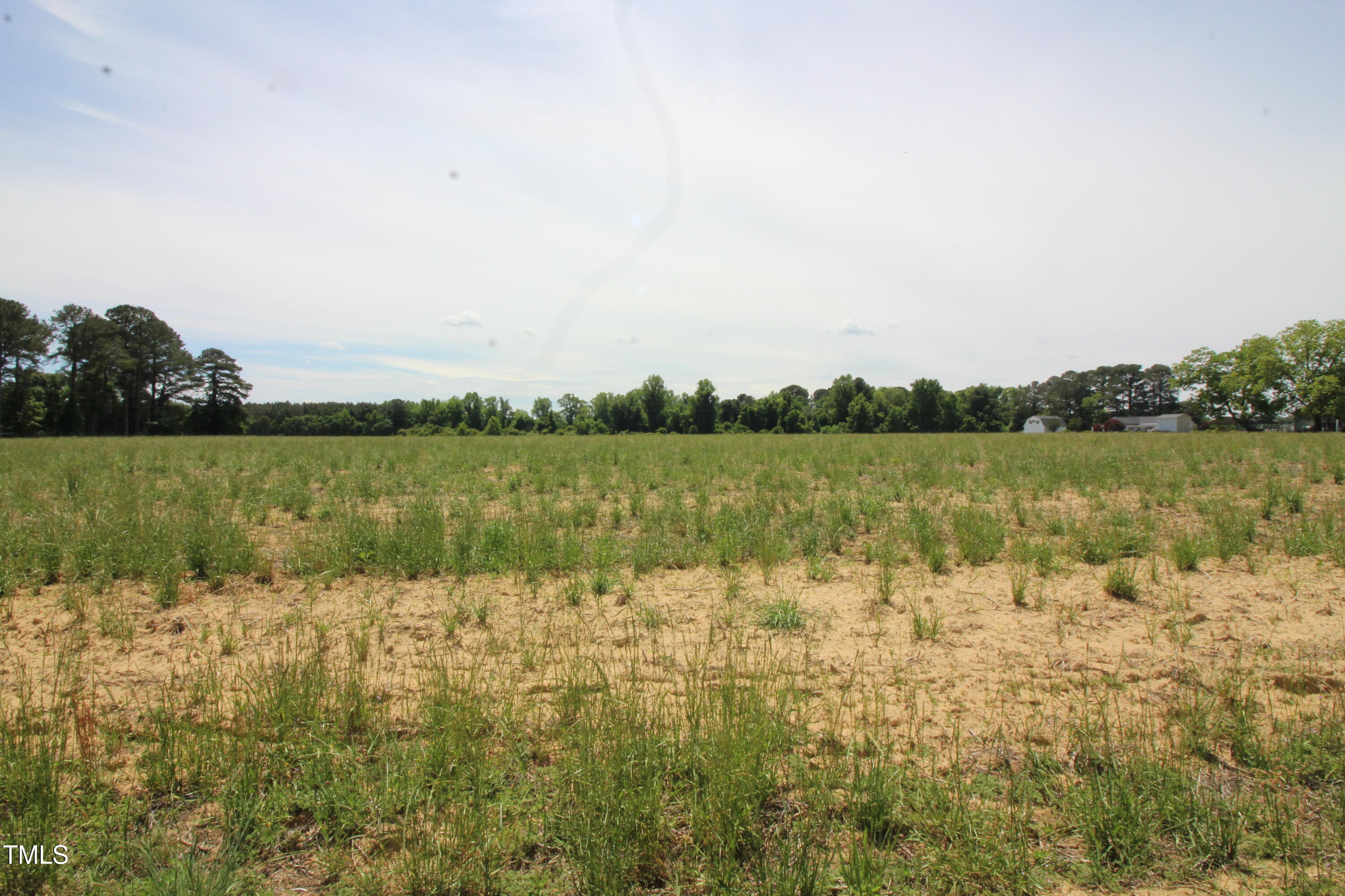 0 John Lee Road Dunn, NC 28334 - Photo 7 of 12 a view of lake with houses in background