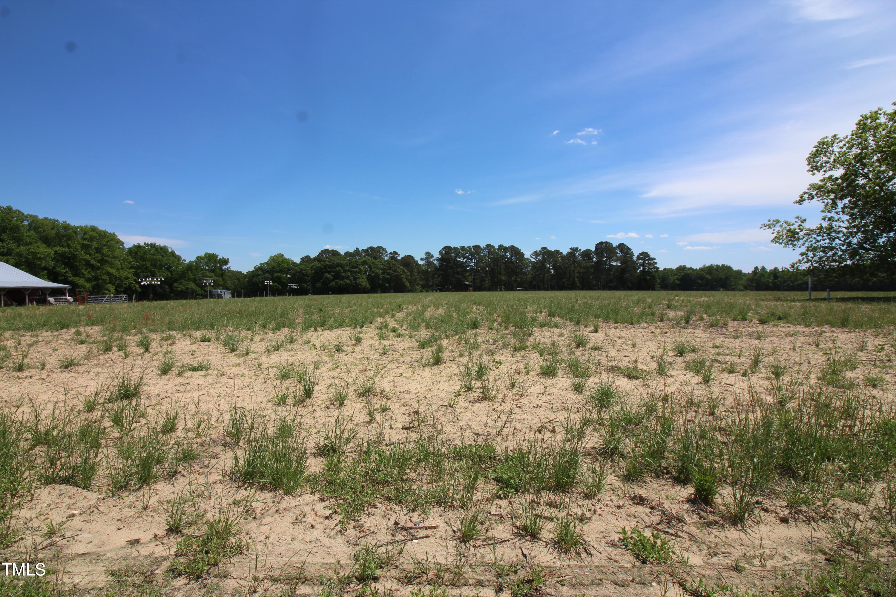 0 John Lee Road Dunn, NC 28334 - Photo 9 of 12 a view of a lake with houses in the background