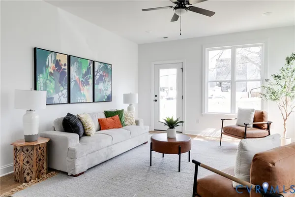 a living room with furniture and a large window