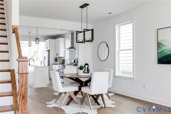 a dining room with furniture and window