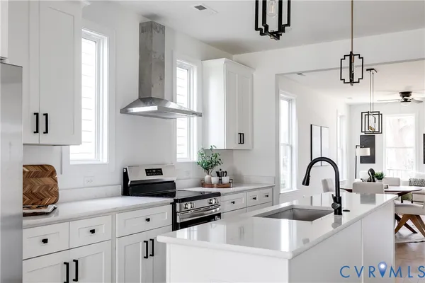 a kitchen with cabinets a sink and appliances