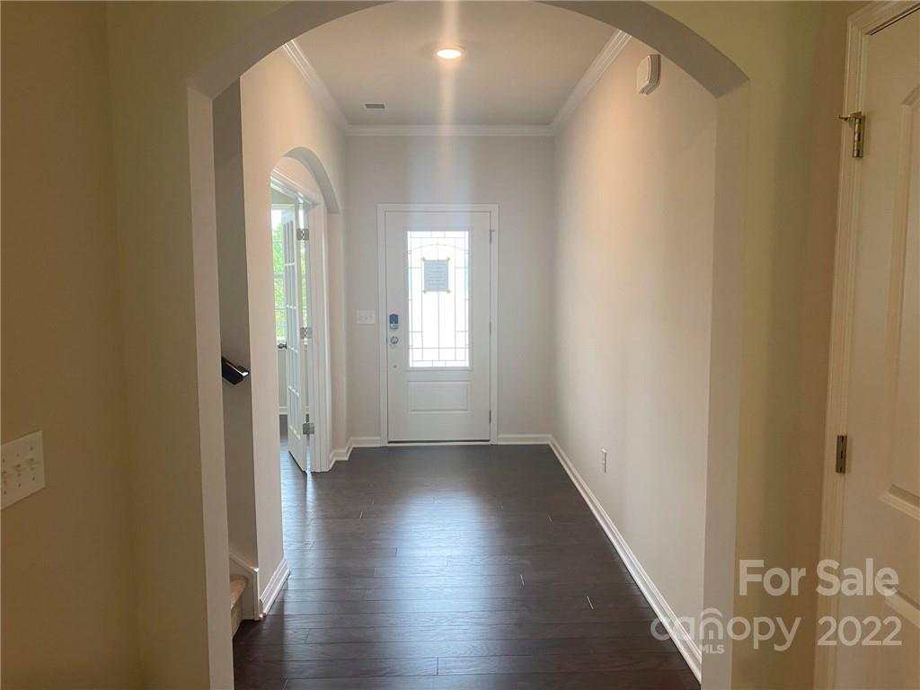 4043 Oakmere Road, Unit 953 Waxhaw, NC 28173 - Photo 5 of 21 an empty room with wooden floor and windows
