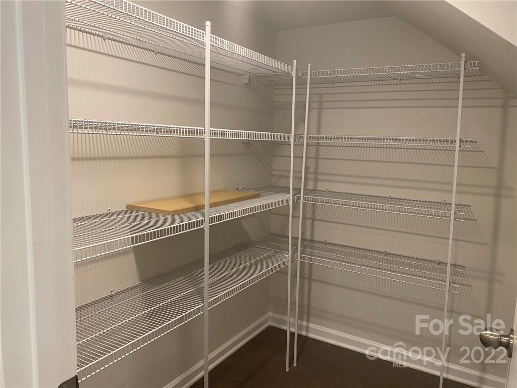 4043 Oakmere Road, Unit 953 Waxhaw, NC 28173 - Photo 7 of 21 a view of a room with racks on the wall