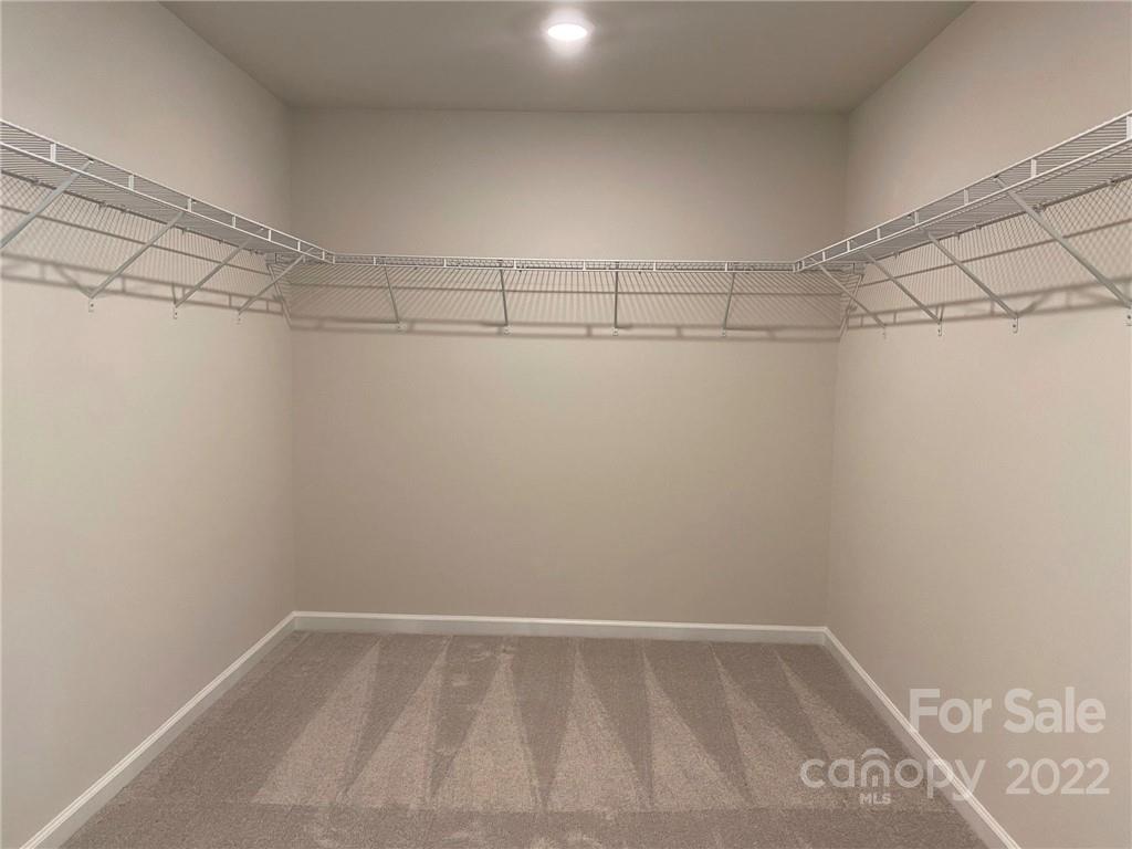 4043 Oakmere Road, Unit 953 Waxhaw, NC 28173 - Photo 10 of 21 a view of a room with racks on the wall