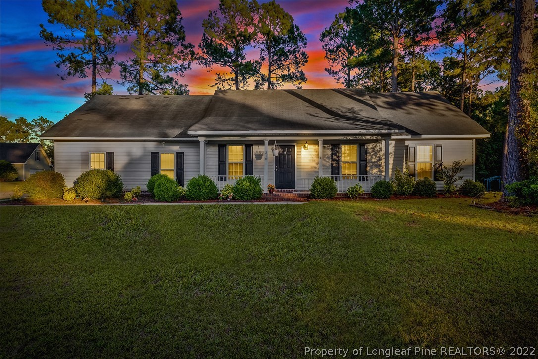 370 Sawyer Road Cameron, NC 28326 - Photo 1 of 26 a front view of house with yard and green space