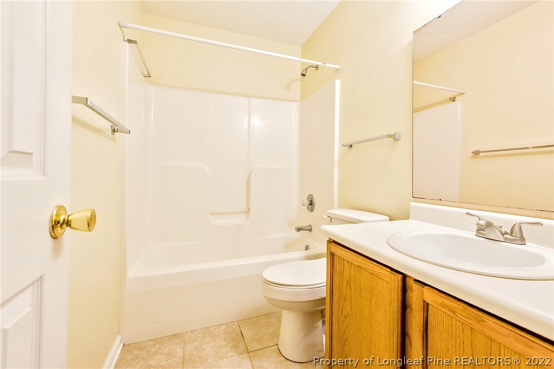 370 Sawyer Road Cameron, NC 28326 - Photo 13 of 26 a bathroom with a sink a toilet and shower