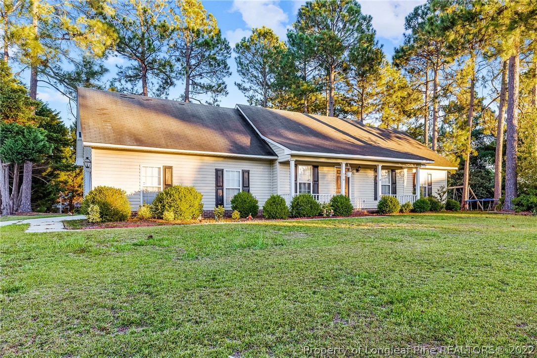 370 Sawyer Road Cameron, NC 28326 - Photo 4 of 26 a front view of a house with a yard