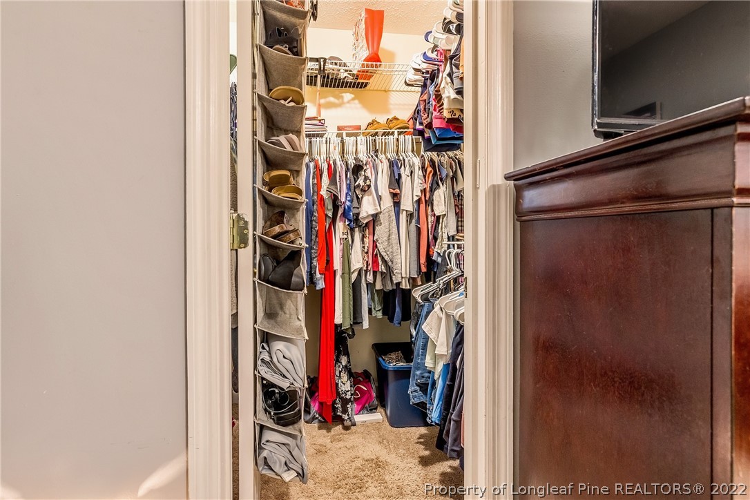 370 Sawyer Road Cameron, NC 28326 - Photo 10 of 26 a view of walk in closet with clothes