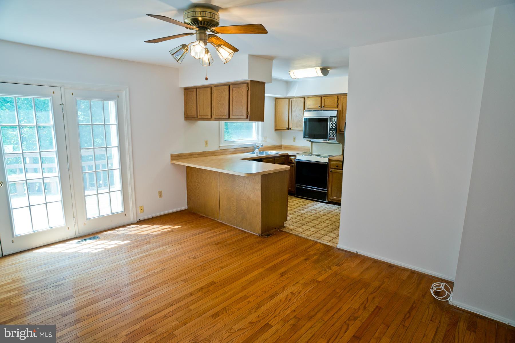 a kitchen with stainless steel appliances granite countertop a stove and a sink
