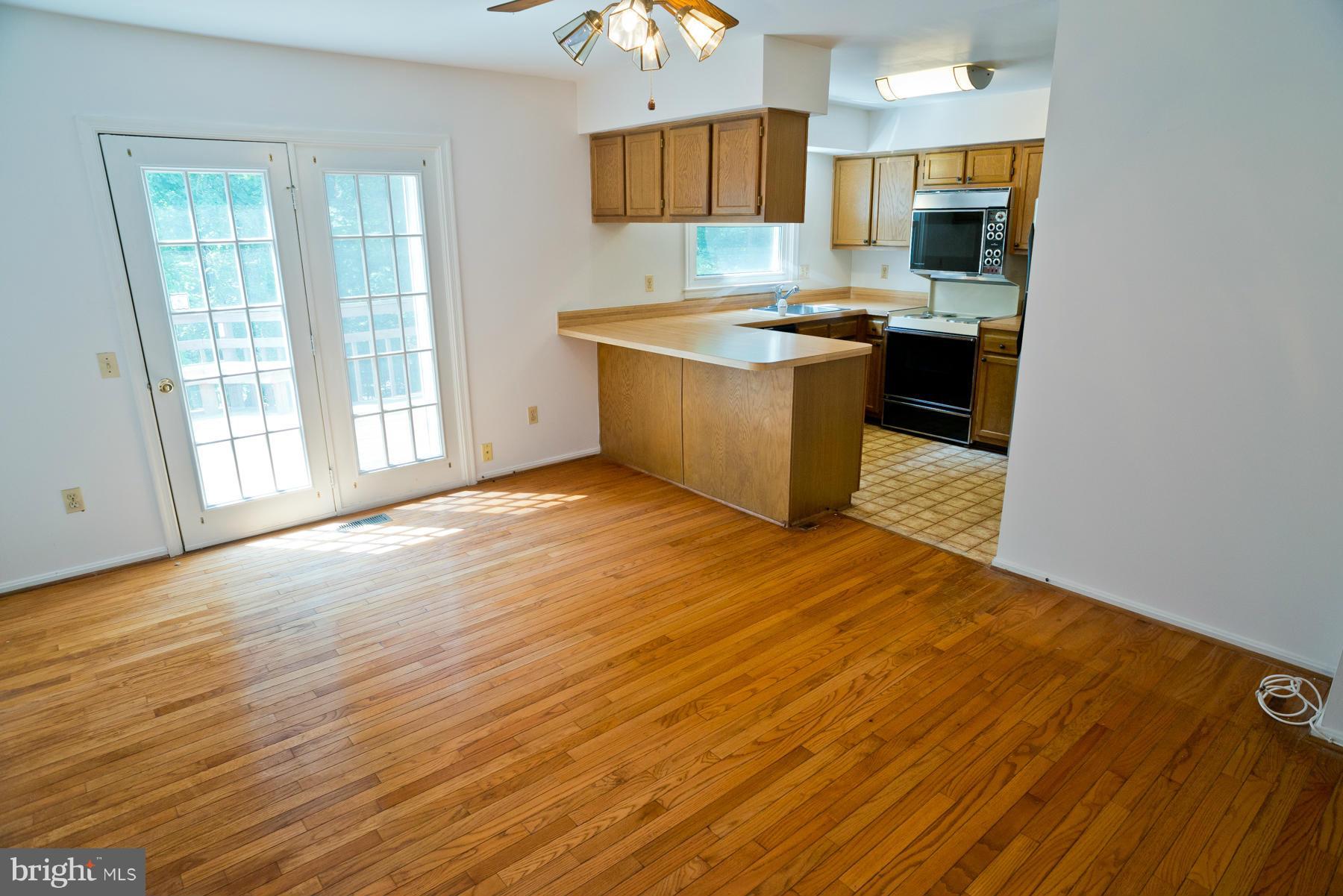 325 Crescendo Way Silver Spring, MD 20901 - Photo 11 of 21 a view of kitchen with wooden floor