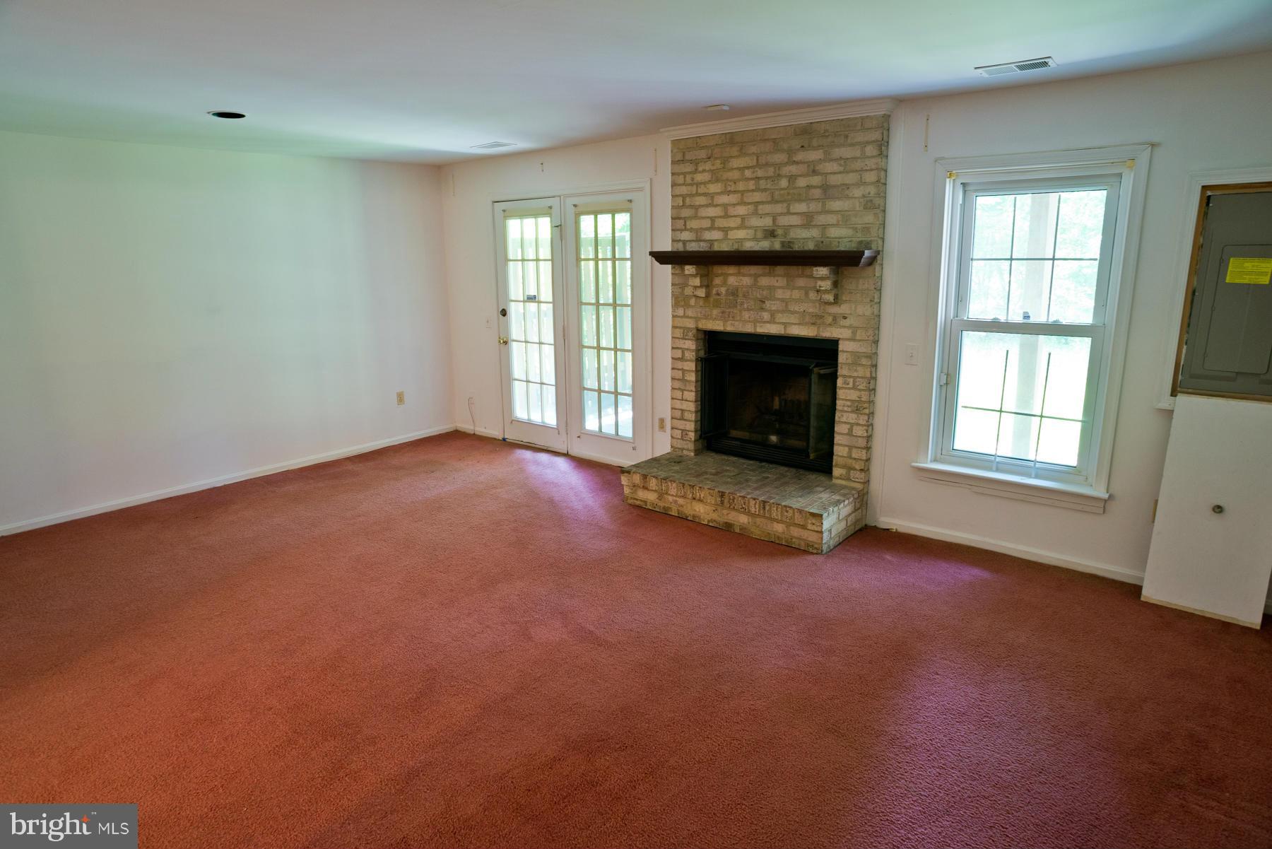 325 Crescendo Way Silver Spring, MD 20901 - Photo 21 of 21 an empty room with windows and fireplace