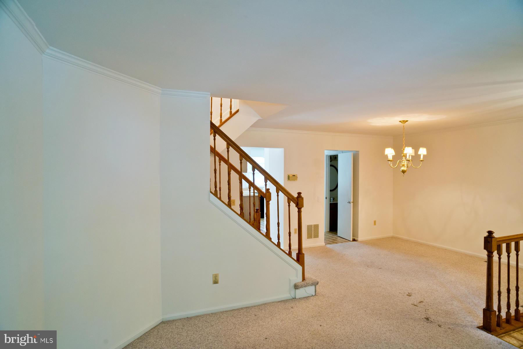 325 Crescendo Way Silver Spring, MD 20901 - Photo 6 of 21 a view of a hallway with staircase
