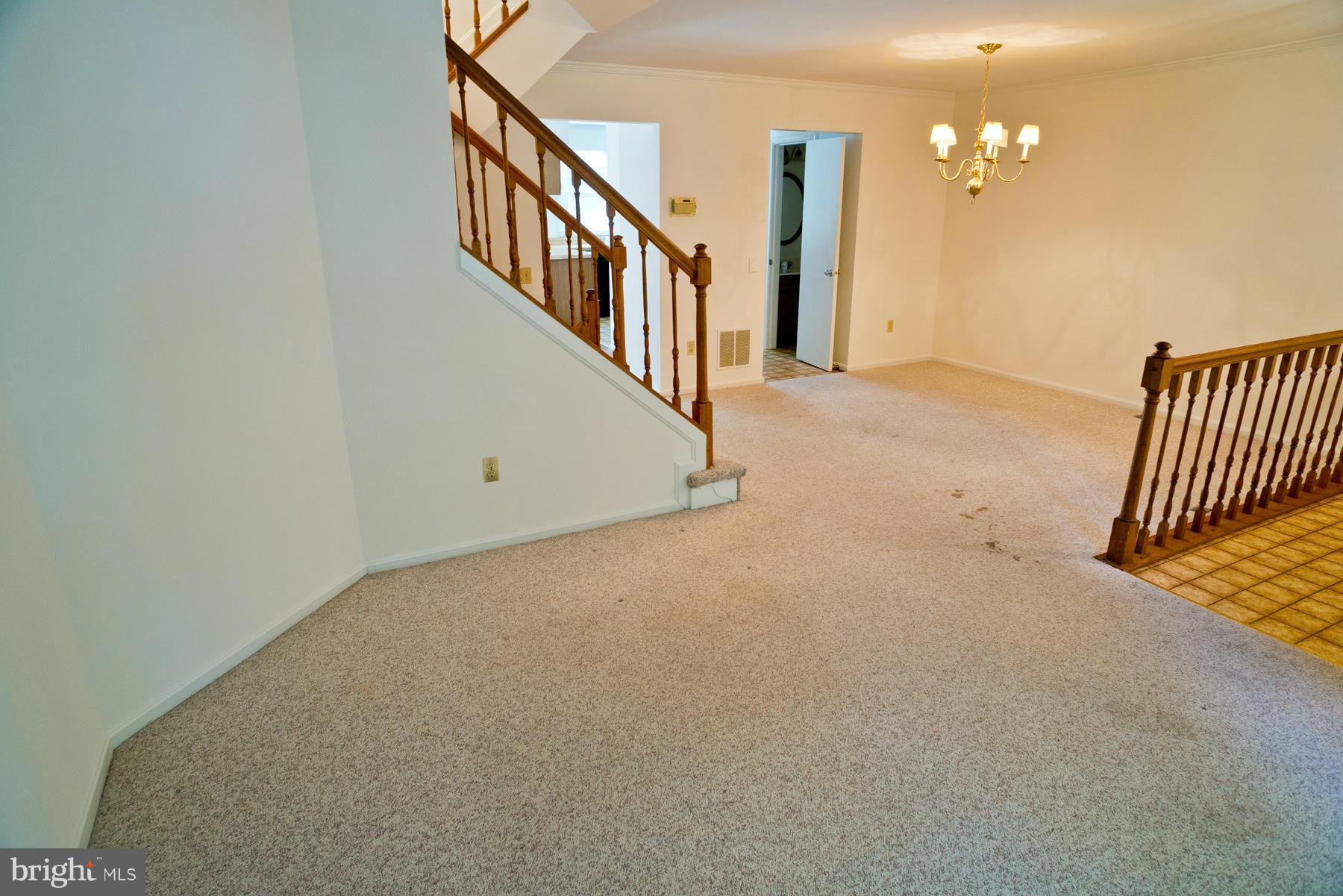 325 Crescendo Way Silver Spring, MD 20901 - Photo 7 of 21 a view of a hallway with staircase