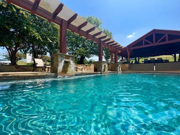 an aerial view of a house with a swimming pool