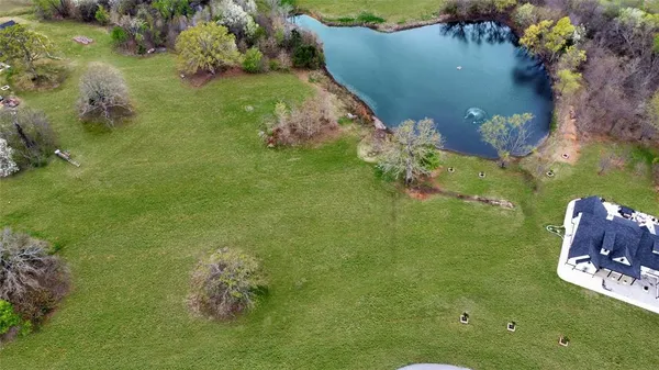 an aerial view of a golf course with an outdoor space